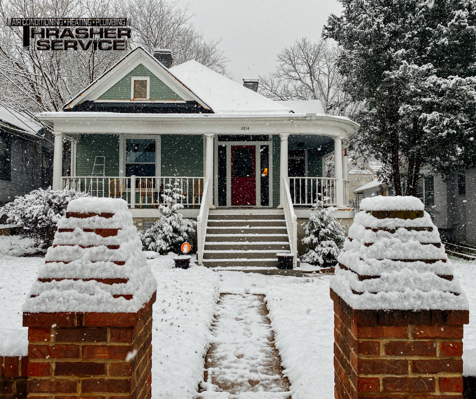 A snow covered Des Moines area home that is warm inside after getting a new furnace installed by Thrasher Service of Des Moines.