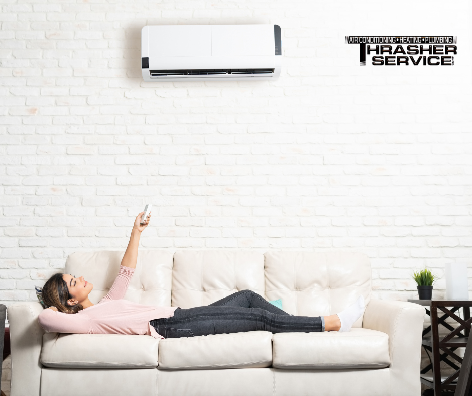 A Des Moines homeowner enjoying the comfort her ductless mini split system provides after being serviced by Thrasher Service in Des Moines, Iowa. 